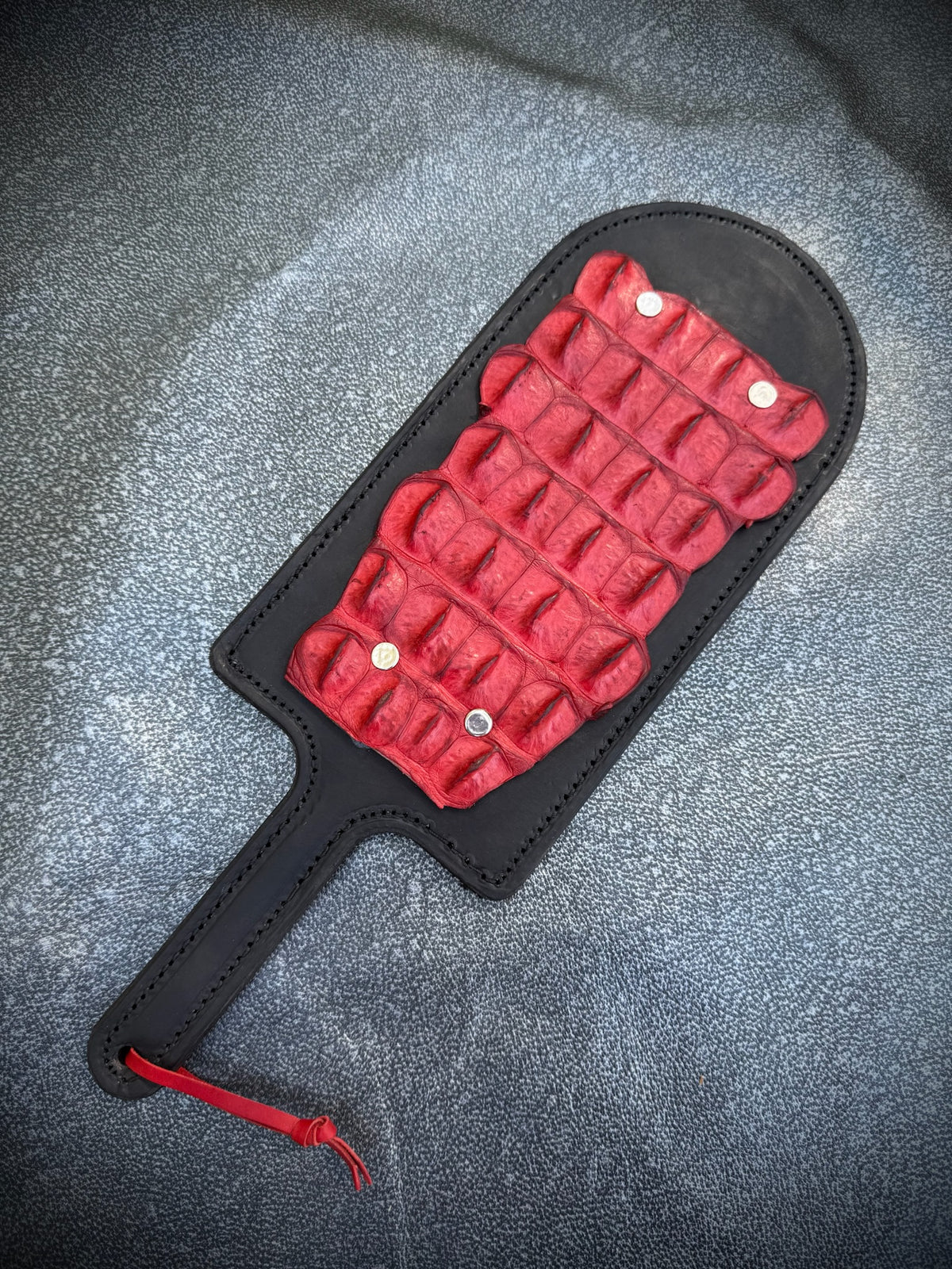 Red leather paddle with red crocodile inlay, handmade in Australia