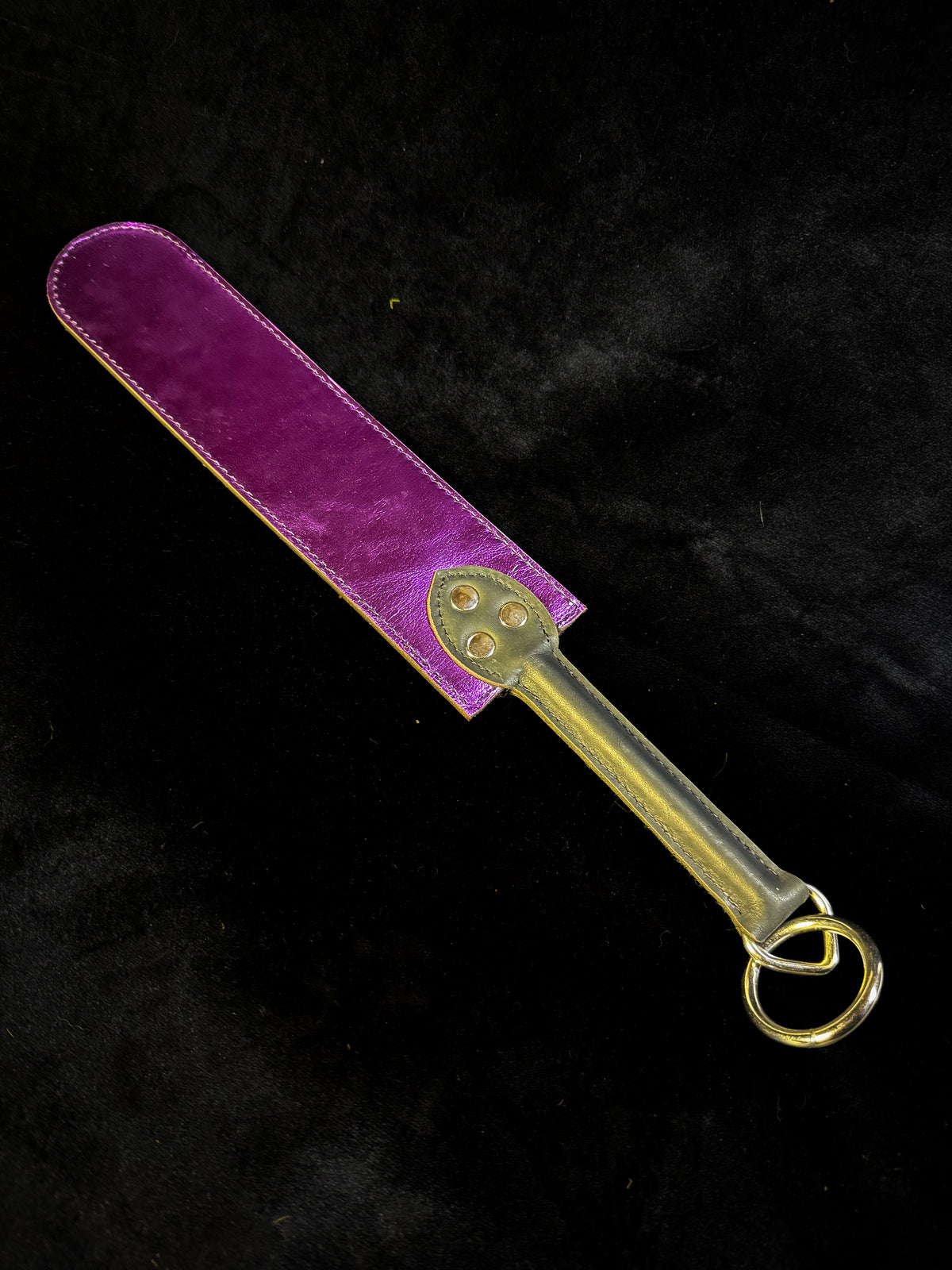 Brown and purple leather flapper paddle, detail