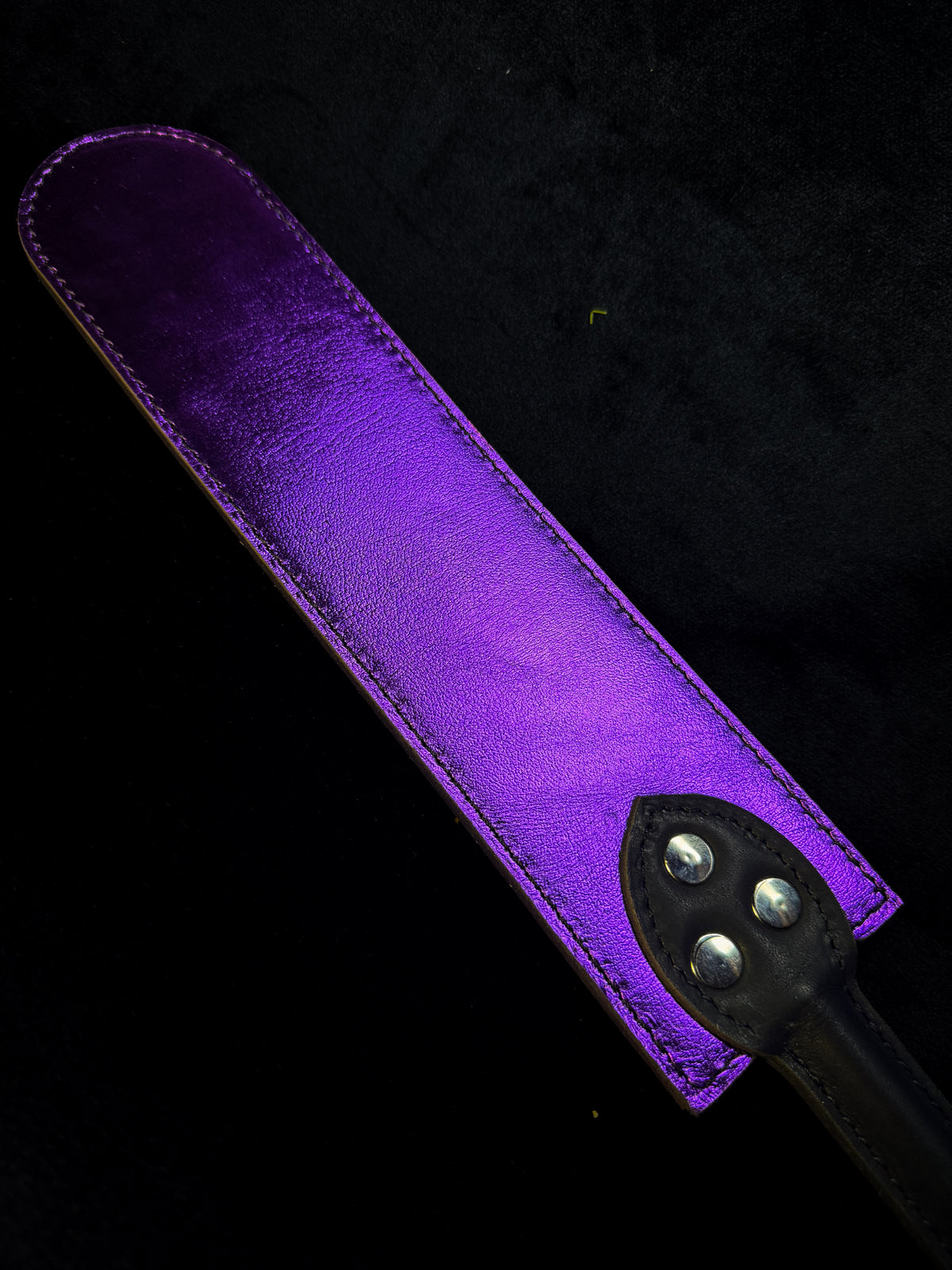 Brown and purple leather flapper paddle, detail
